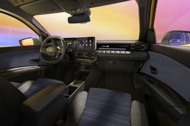 Intérieur de la Renault 5 E-Tech electric 2026 avec écran tactile et sellerie gris/bleu