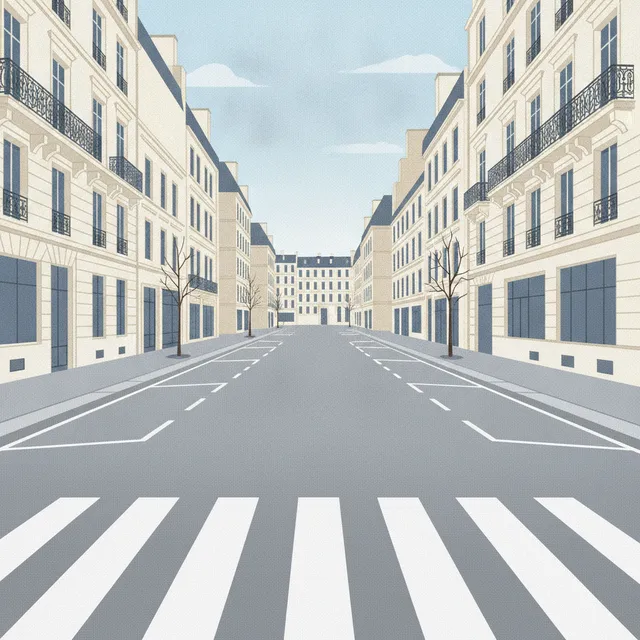 Passage piéton dégagé dans une rue de ville avec places de stationnement vides juste avant la traversée