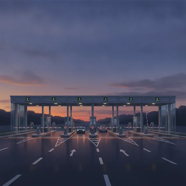 Gare de péage d'autoroute française au crépuscule, barrières levées et voies de passage